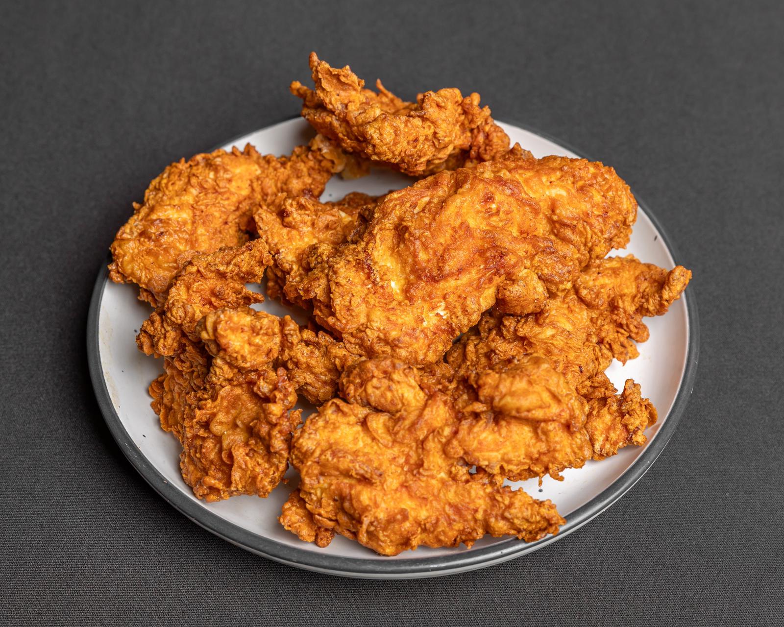 Plate of golden fried chicken tenders